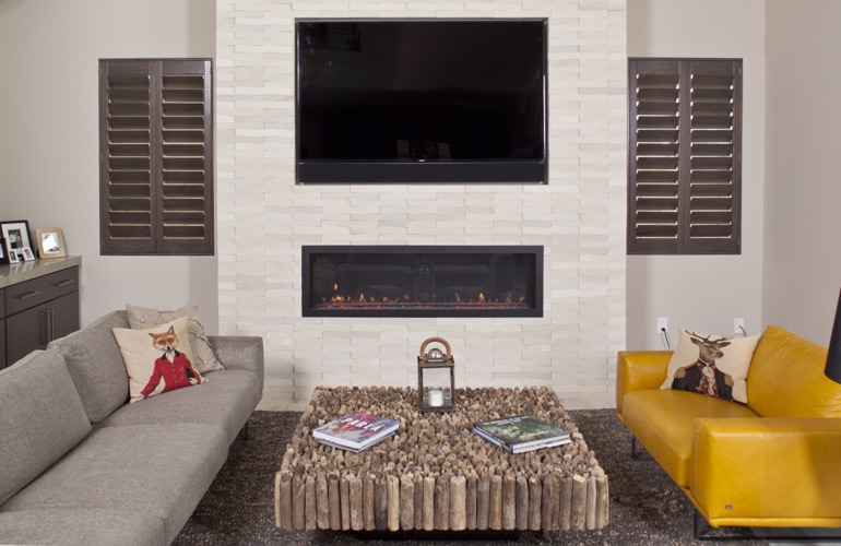 Ovation wood shutters in living room with fireplace